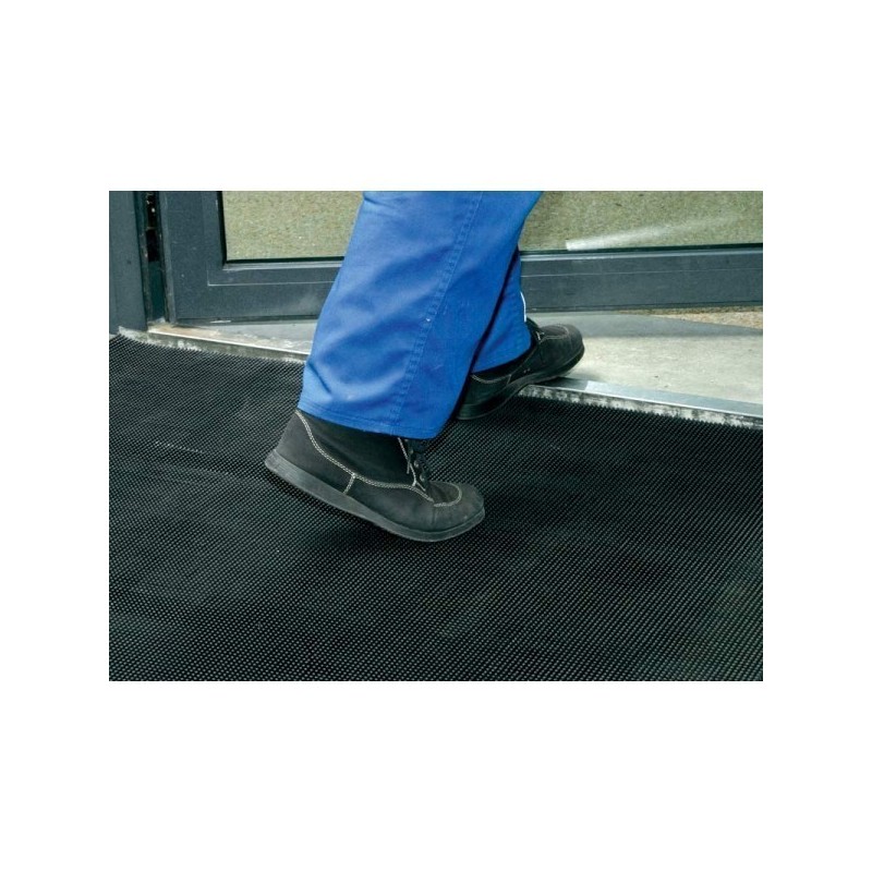 Tapis à picots avec bords arrondis offrant un confort et une stabilité optimale.