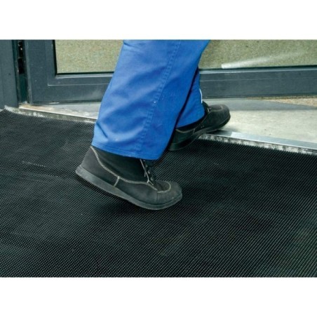 Tapis à picots avec bords arrondis offrant un confort et une stabilité optimale.