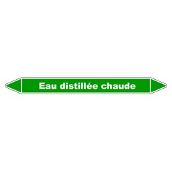 Marqueur de tuyauterie résistant indiquant 'Eau distillée chaude' en vinyle laminé.